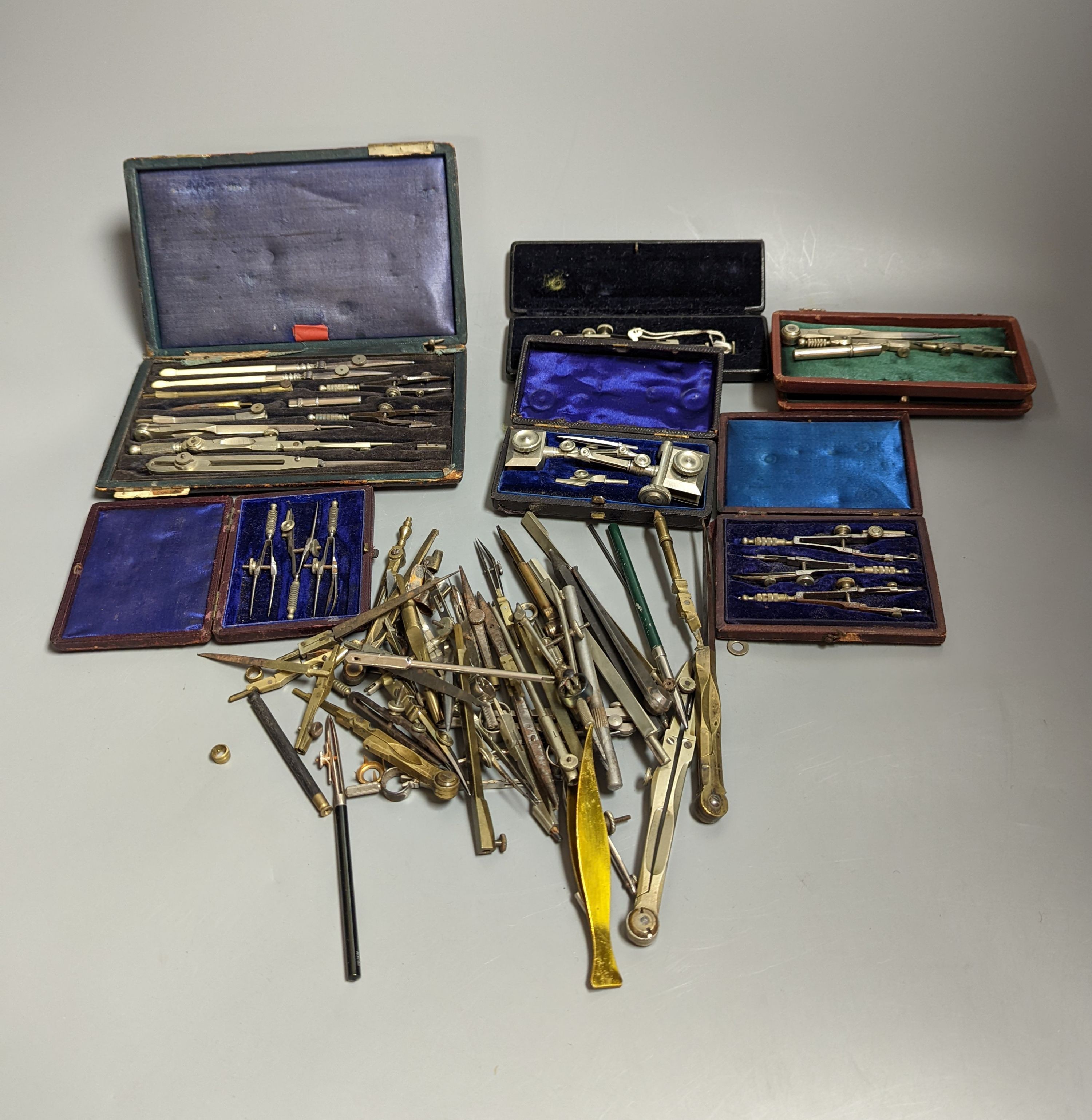 A collection of cased and loose drawing instruments and two empty cases (12)